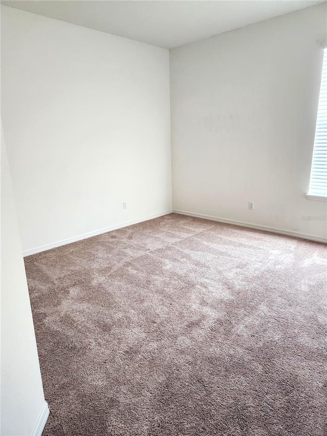 4032 Prairie Reserve Blvd, Orlando, FL 32824 - empty room featuring carpet floors and baseboards