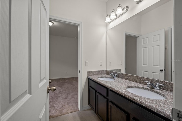 4032 Prairie Reserve Blvd, Orlando, FL 32824 - bathroom with double vanity and baseboards