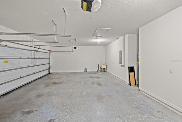 4032 Prairie Reserve Blvd, Orlando, FL 32824 - garage with a garage door opener, electric panel, and concrete block wall