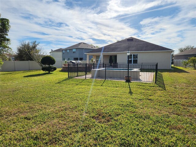 4032 Prairie Reserve Blvd, Orlando, FL 32824 - rear view of house featuring stucco siding, a shingled roof, and a patio