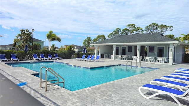 view of swimming pool featuring a patio area