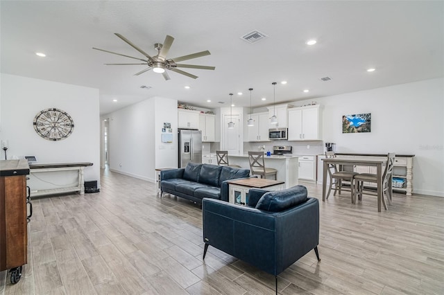 living room featuring ceiling fan