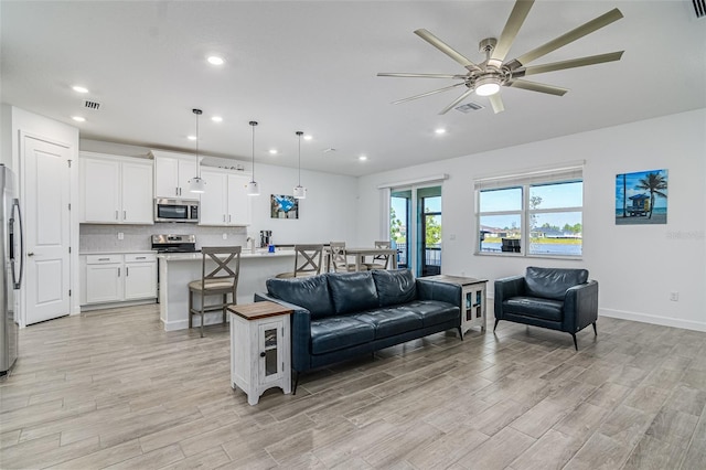 living room featuring ceiling fan