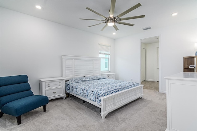 bedroom featuring ceiling fan and light carpet