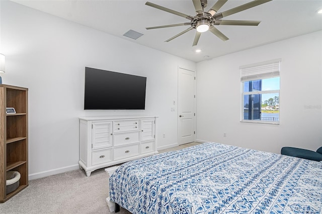 bedroom with light carpet and ceiling fan