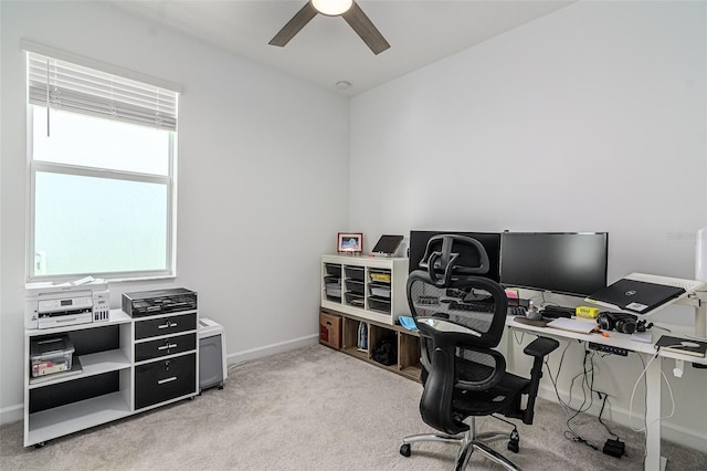 carpeted office with ceiling fan