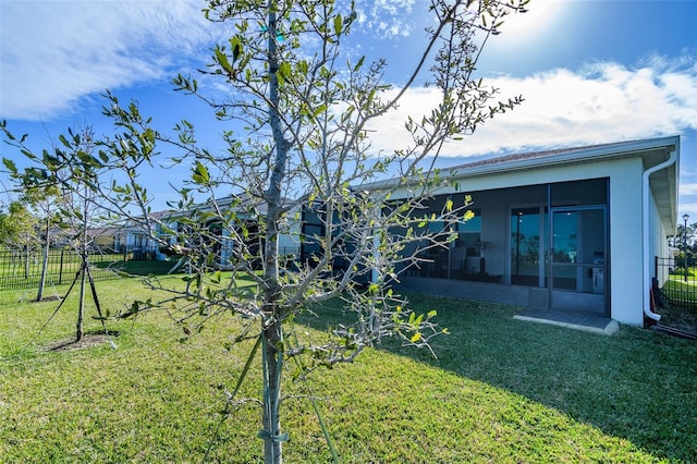 view of yard featuring a sunroom