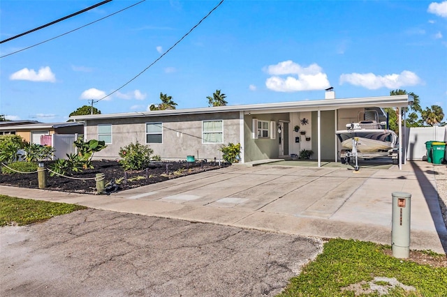 view of front of property featuring a carport