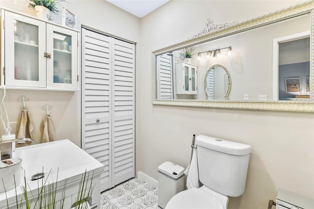 bathroom featuring tile patterned floors and toilet