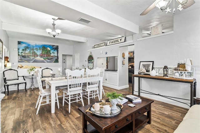 interior space featuring dark hardwood / wood-style flooring and a chandelier