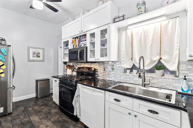 kitchen featuring appliances with stainless steel finishes, backsplash, ceiling fan, sink, and white cabinets