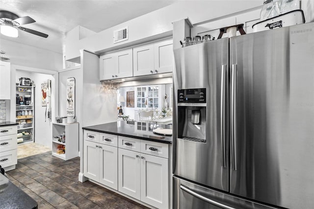 kitchen featuring ceiling fan, white cabinets, dark hardwood / wood-style floors, and stainless steel refrigerator with ice dispenser