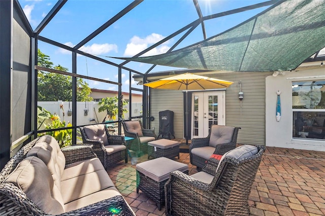 view of patio / terrace with outdoor lounge area, french doors, and glass enclosure