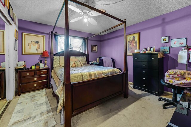 2868 N Powers Dr Unit 5, Orlando, FL 32818 - bedroom featuring light colored carpet, ceiling fan, and a textured ceiling