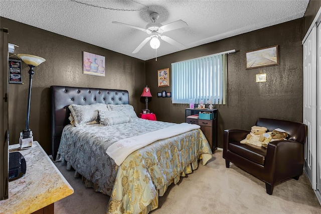 2868 N Powers Dr Unit 5, Orlando, FL 32818 - carpeted bedroom featuring a textured ceiling, a textured wall, and ceiling fan