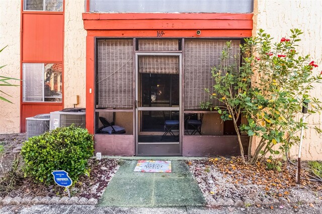 2868 N Powers Dr Unit 5, Orlando, FL 32818 - doorway to property featuring cooling unit
