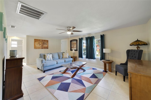 living room featuring ceiling fan and light tile patterned flooring