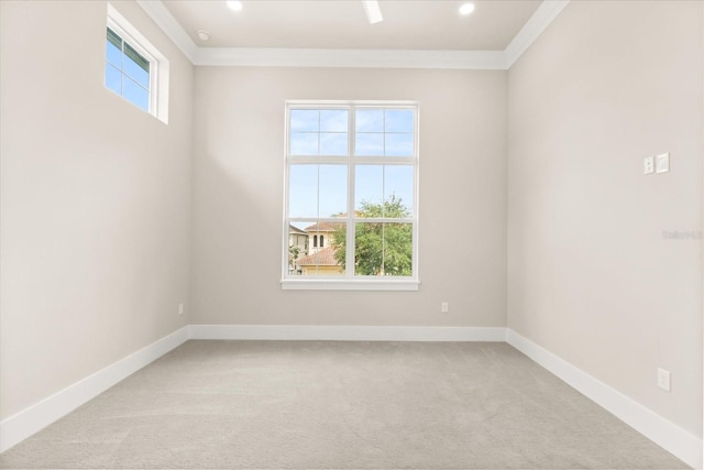 spare room featuring carpet flooring, recessed lighting, baseboards, and ornamental molding