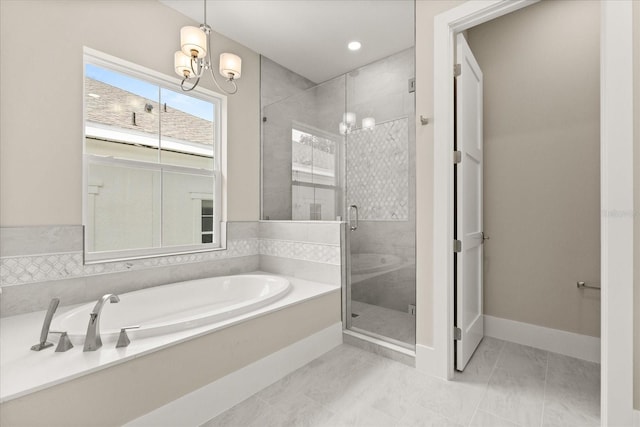 bathroom featuring an inviting chandelier, a garden tub, baseboards, recessed lighting, and a shower stall