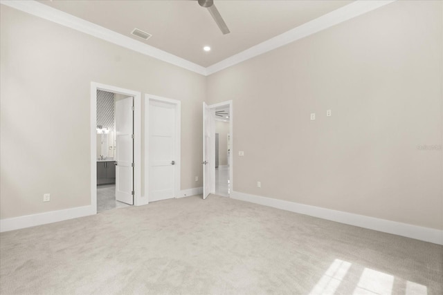 unfurnished bedroom with visible vents, ornamental molding, light carpet, recessed lighting, and ensuite bath