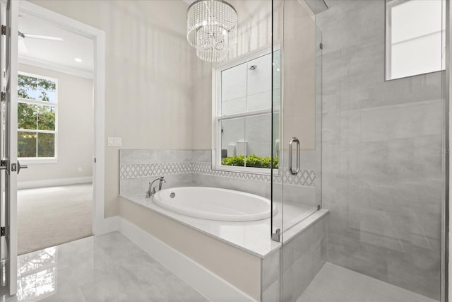 full bath featuring crown molding, an inviting chandelier, baseboards, a bath, and a stall shower