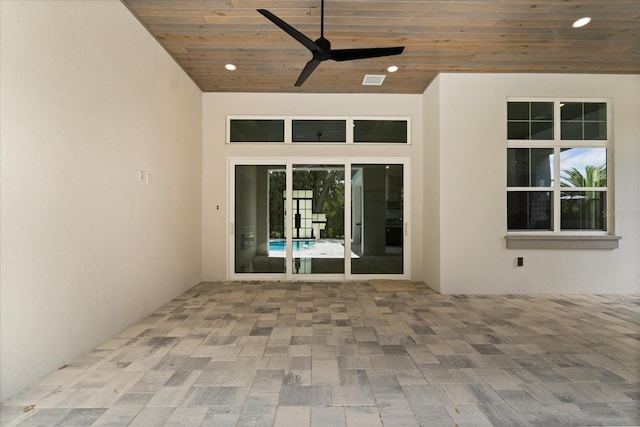exterior space with visible vents and a ceiling fan