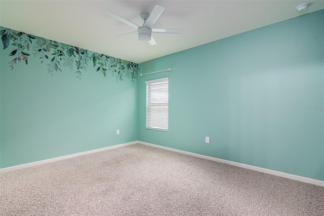 spare room with carpet floors and ceiling fan