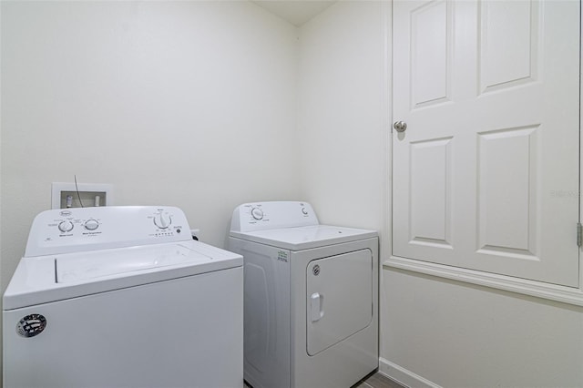 clothes washing area with independent washer and dryer