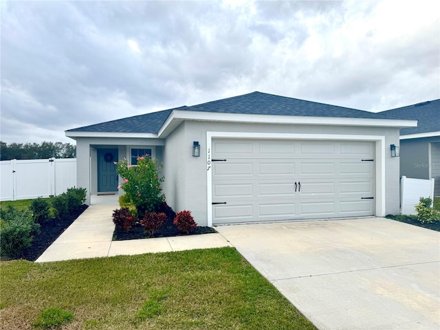 ranch-style house with a garage and a front lawn