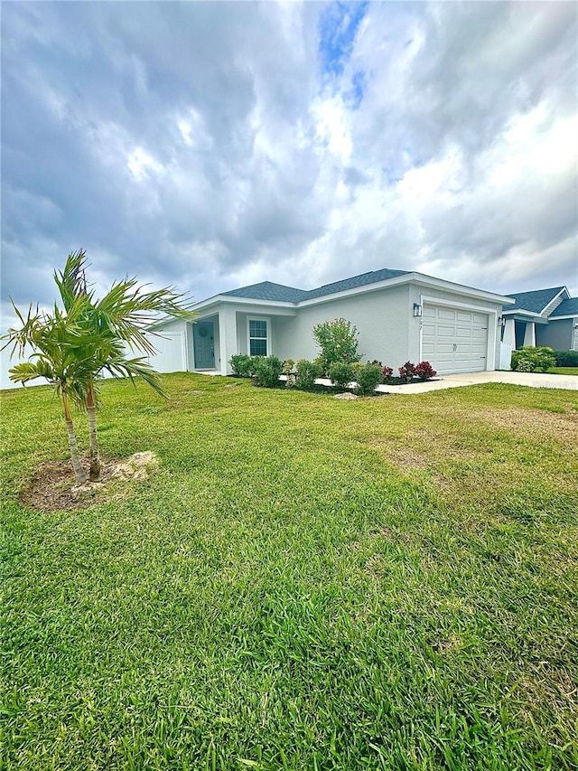 ranch-style home with a garage and a front yard