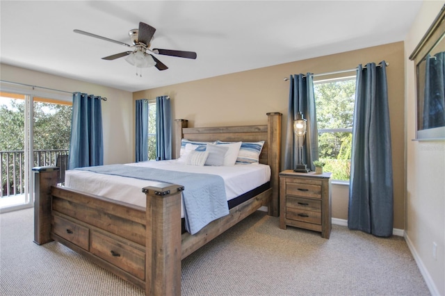 carpeted bedroom featuring access to outside and ceiling fan