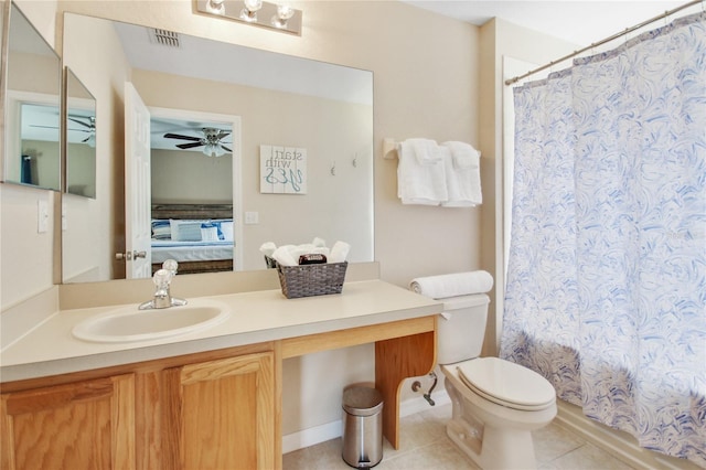 bathroom featuring vanity, ceiling fan, tile patterned flooring, toilet, and curtained shower