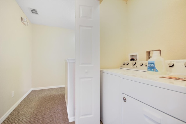 washroom with carpet flooring and separate washer and dryer