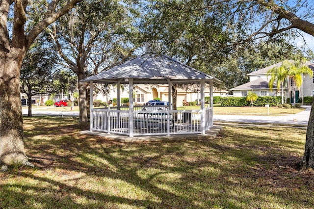 view of home's community with a gazebo and a yard