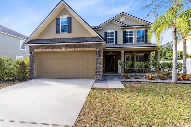 view of front of house with a front lawn, covered porch, and a garage