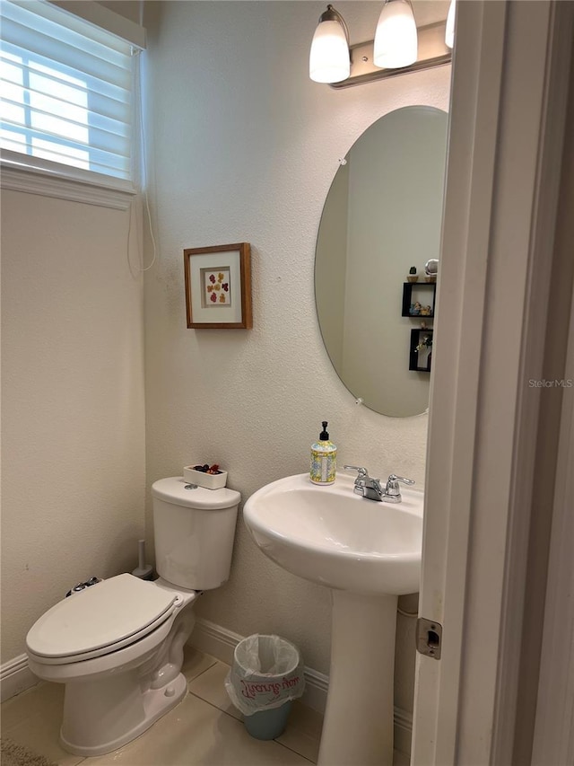 bathroom with tile patterned floors and toilet