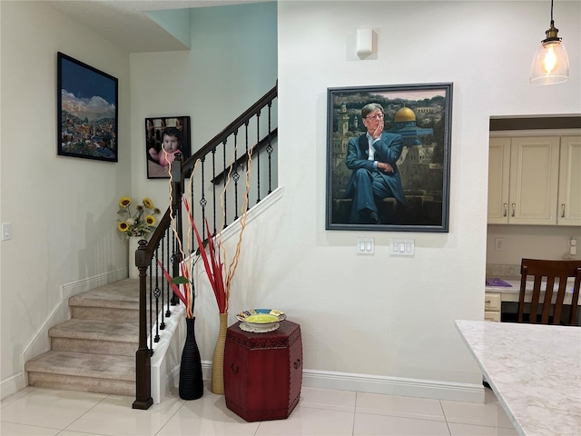 staircase featuring tile patterned flooring