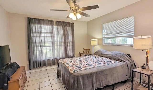 tiled bedroom with ceiling fan