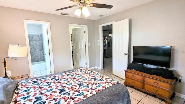 bedroom featuring ceiling fan, light tile patterned floors, and connected bathroom