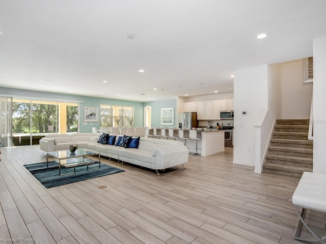 living room with light hardwood / wood-style flooring