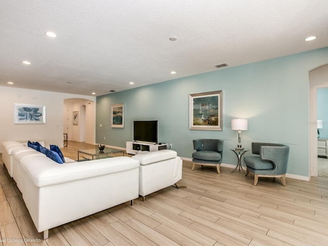 living room with light hardwood / wood-style floors