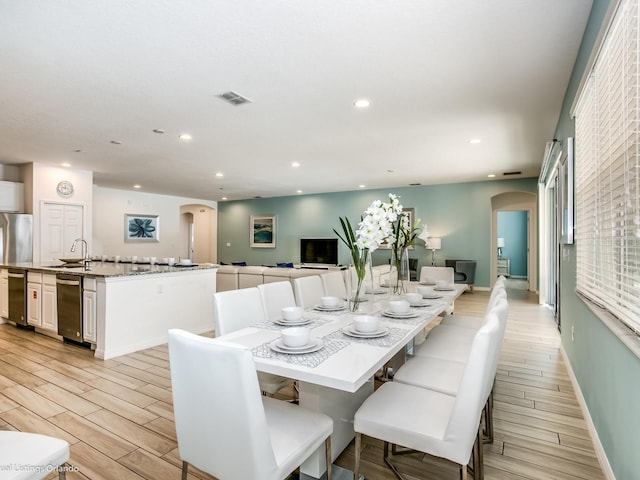 dining room featuring sink