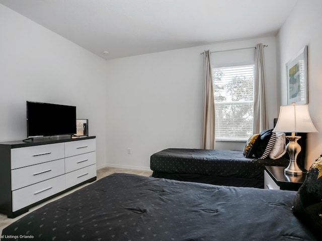 bedroom with light carpet