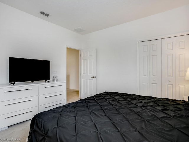 bedroom with carpet flooring and a closet