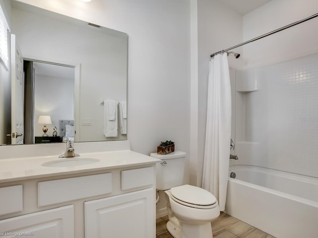 full bathroom with vanity, shower / bathtub combination with curtain, wood-type flooring, and toilet