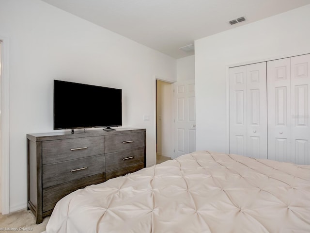 carpeted bedroom with a closet