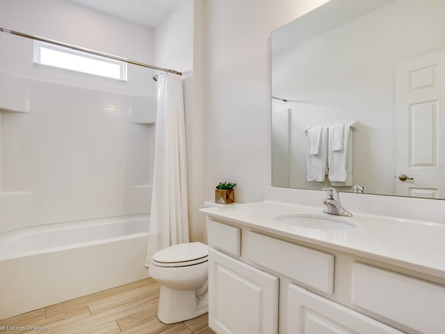 full bathroom with vanity, toilet, and shower / tub combo with curtain