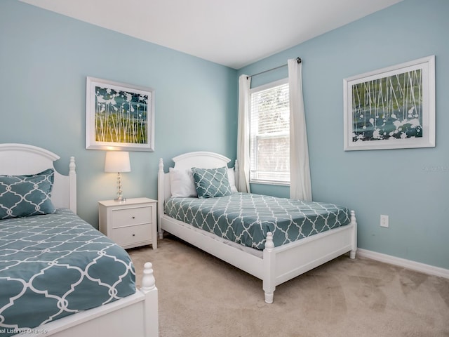 bedroom with light carpet