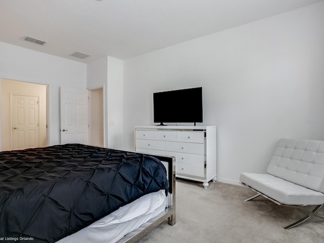 bedroom with light colored carpet