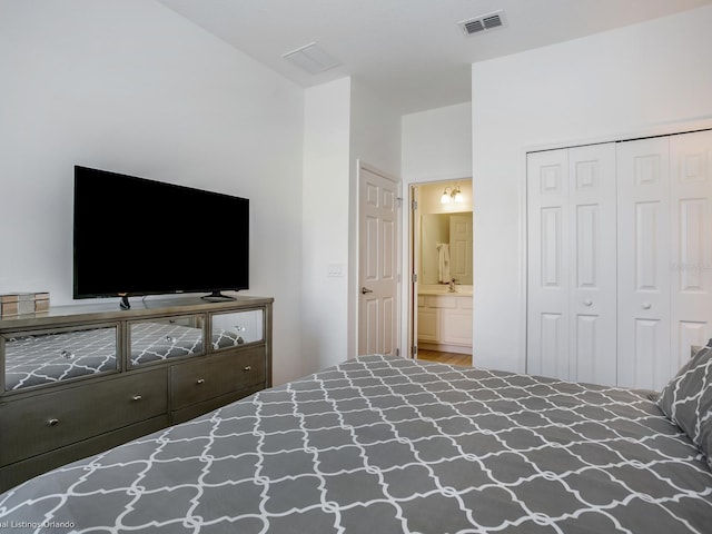 bedroom featuring ensuite bathroom and a closet